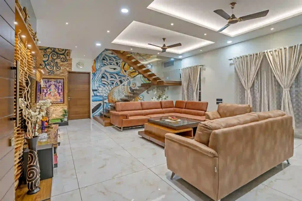 Stylish false ceiling for a modern living room with two ceiling fans